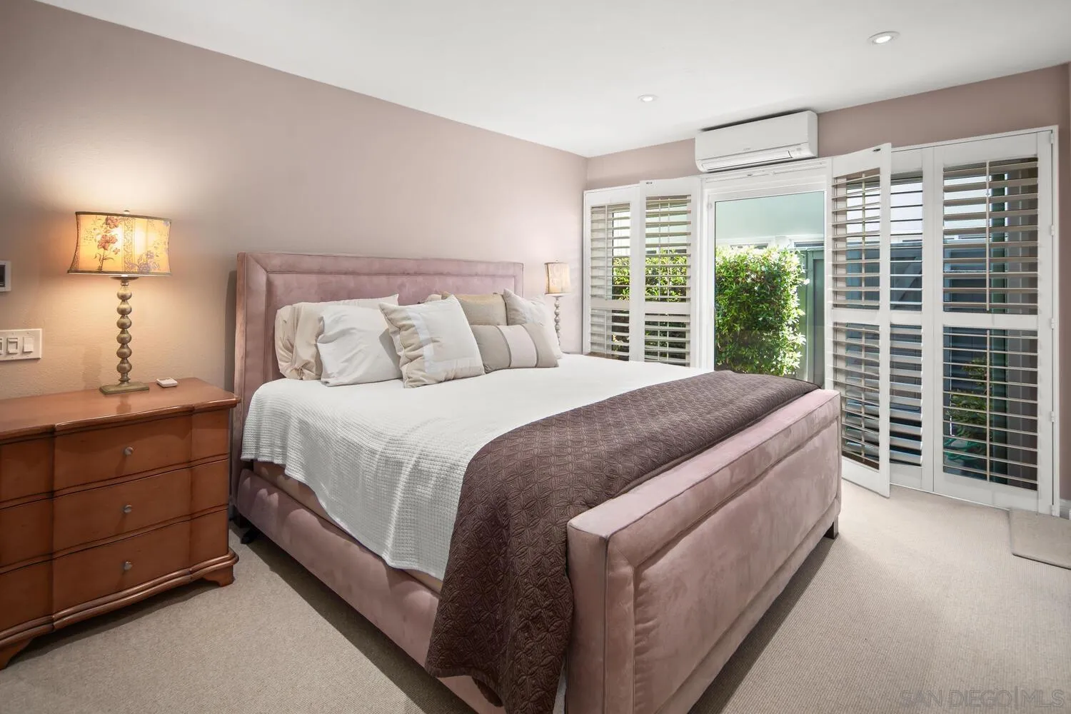 37 Antigua Court Coronado, CA 92118 - Photo 31 of 39 a large bed sitting in a bedroom next to a window