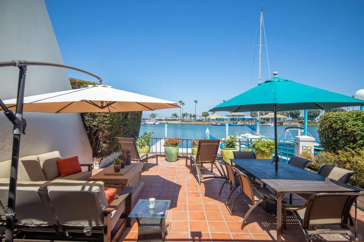 37 Antigua Court Coronado, CA 92118 - Photo 5 of 39 a patio with tables and chairs