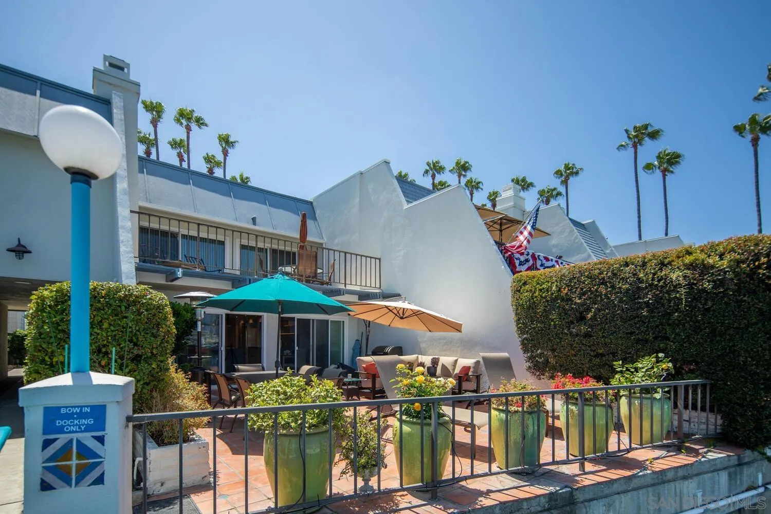 37 Antigua Court Coronado, CA 92118 - Photo 8 of 39 a front view of a house with yard and sitting area