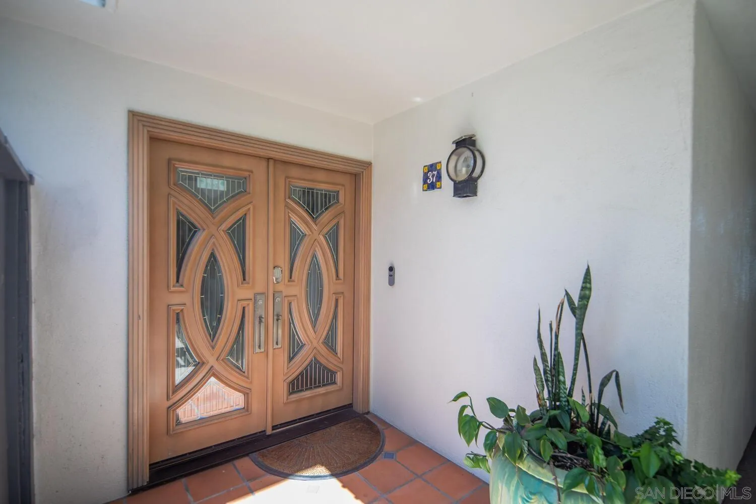 37 Antigua Court Coronado, CA 92118 - Photo 10 of 39 a view of front door with a potted plant