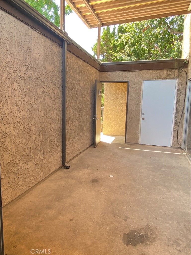 7890 East Spring Street, Unit 19A Long Beach, CA 90815 - Photo 14 of 24 a view of an empty room with a window