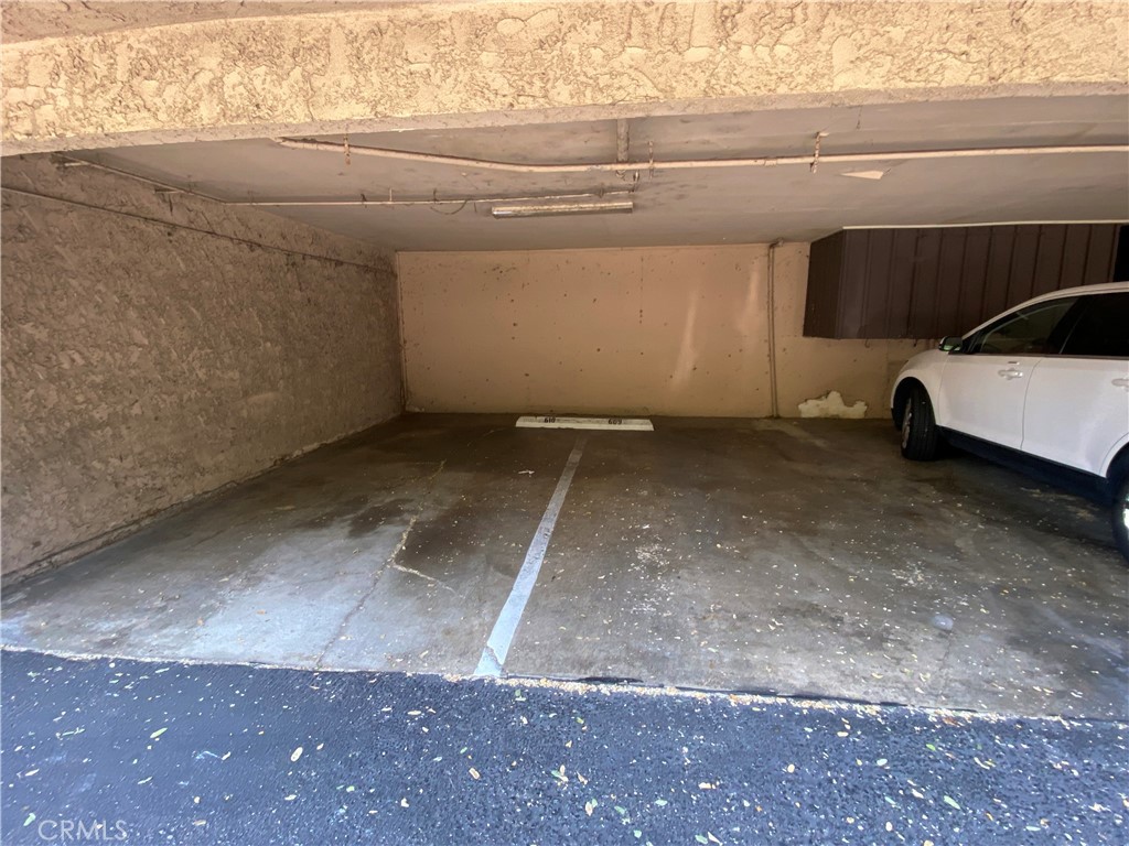 7890 East Spring Street, Unit 19A Long Beach, CA 90815 - Photo 16 of 24 a view of a car garage