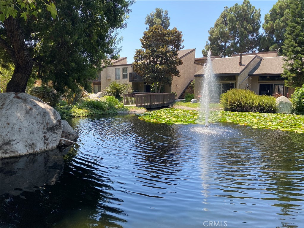 7890 East Spring Street, Unit 19A Long Beach, CA 90815 - Photo 17 of 24 a view of a house with a yard