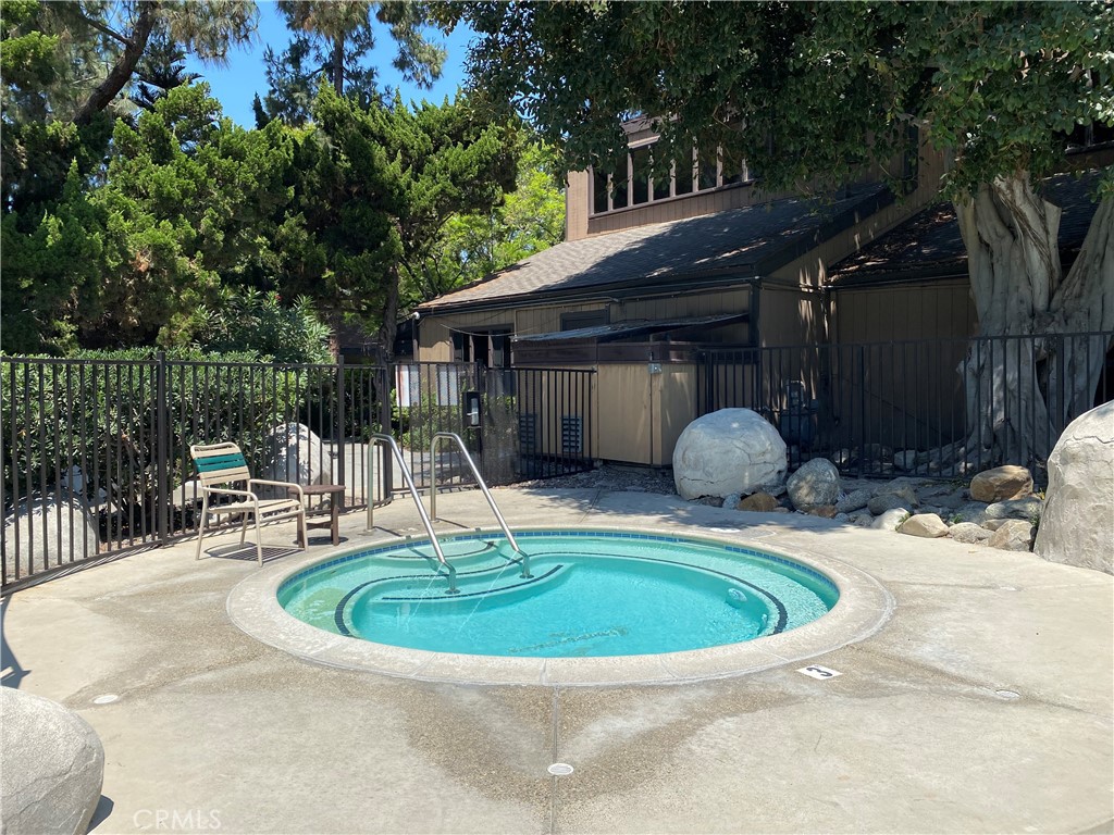 7890 East Spring Street, Unit 19A Long Beach, CA 90815 - Photo 19 of 24 a view of a house with backyard and sitting area