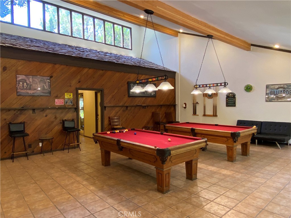 7890 East Spring Street, Unit 19A Long Beach, CA 90815 - Photo 22 of 24 a patio with pool table and chairs