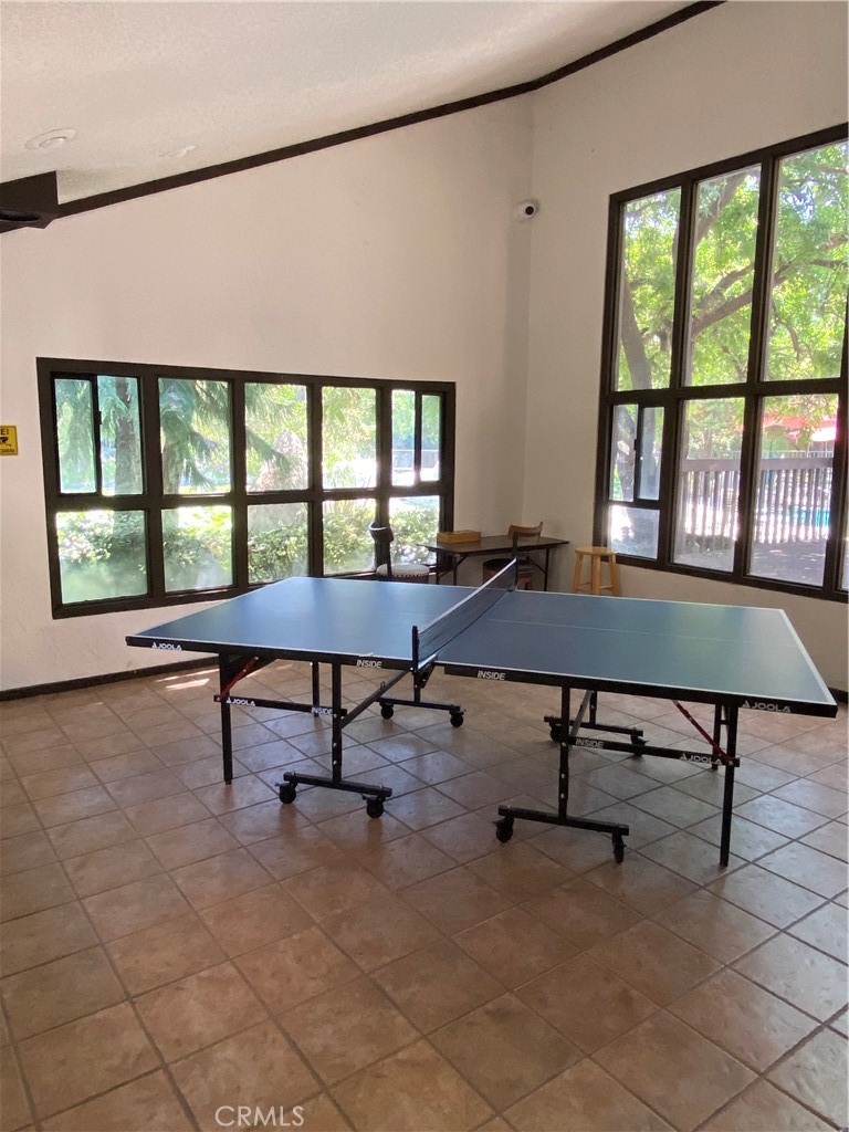 7890 East Spring Street, Unit 19A Long Beach, CA 90815 - Photo 23 of 24 a living room with furniture a rug and a large window