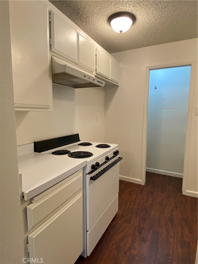 7890 East Spring Street, Unit 19A Long Beach, CA 90815 - Photo 6 of 24 a stove top oven sitting inside of a kitchen