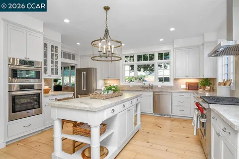 a kitchen with appliances cabinets and a sink