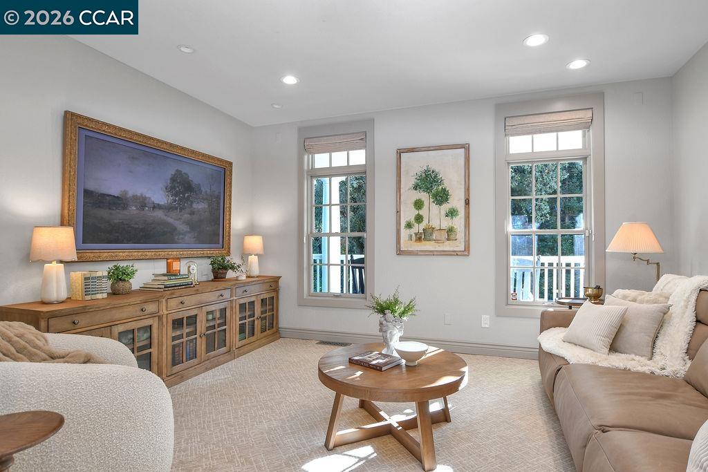 1751 Reliez Valley Road Lafayette, CA 94549 - Photo 15 of 60 a living room with furniture a flat screen tv and a large window