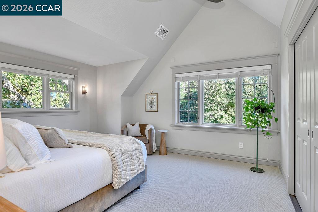 1751 Reliez Valley Road Lafayette, CA 94549 - Photo 17 of 60 a bedroom with a bed and a window