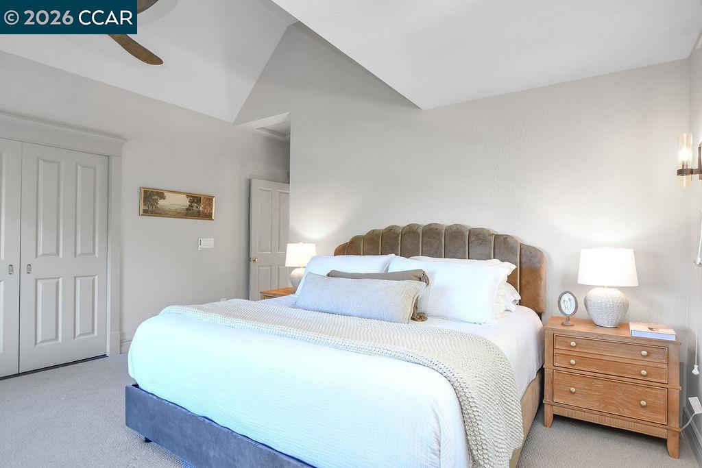 1751 Reliez Valley Road Lafayette, CA 94549 - Photo 18 of 60 a bedroom with a bed and a lamp