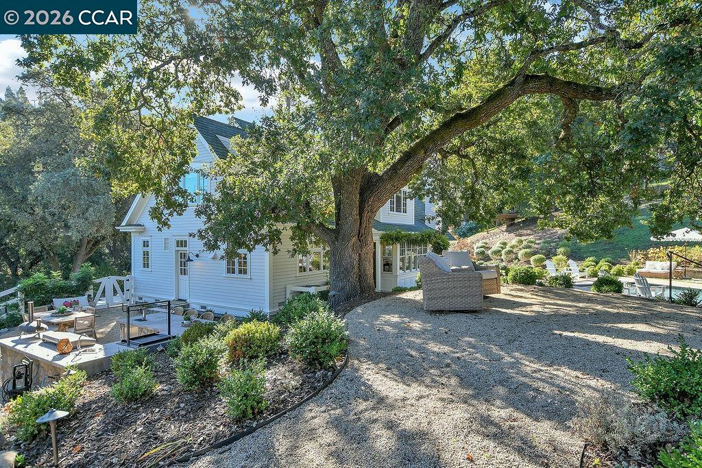 1751 Reliez Valley Road Lafayette, CA 94549 - Photo 28 of 60 a view of a street with potted plants and large trees