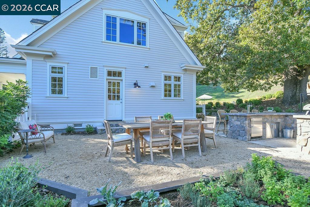 1751 Reliez Valley Road Lafayette, CA 94549 - Photo 34 of 60 a view of a patio with table and chairs and potted plants