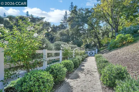 a kitchen with stainless steel appliances granite countertop a stove and a microwave