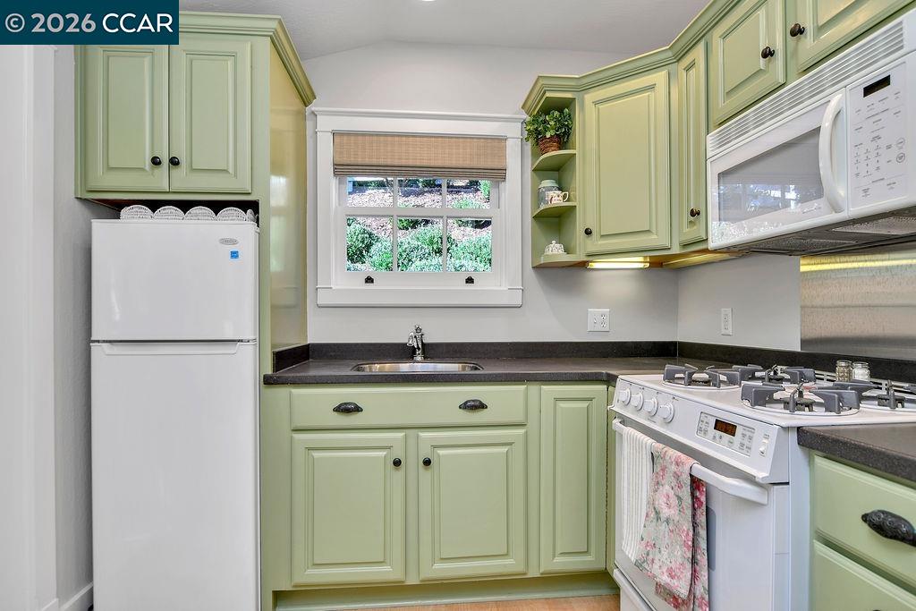 1751 Reliez Valley Road Lafayette, CA 94549 - Photo 46 of 60 a kitchen with stainless steel appliances granite countertop a stove and a microwave