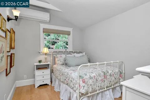 a view of a dining room with furniture and a window