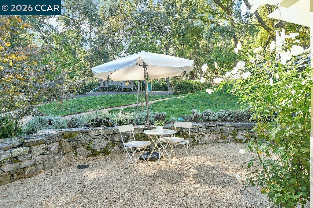 1751 Reliez Valley Road Lafayette, CA 94549 - Photo 49 of 60 a view of a tables and chairs under an umbrella