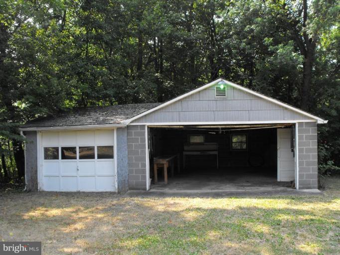 116 Paw Paw Road North Bloomery, WV 26817 - Photo 12 of 16 a front view of a house with a garage