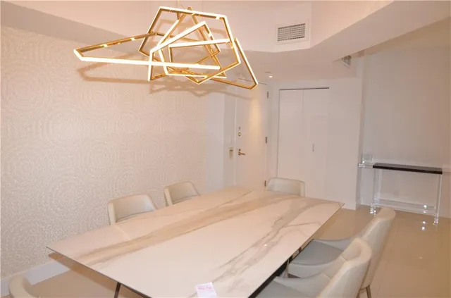 a bedroom with a bed and a mirror