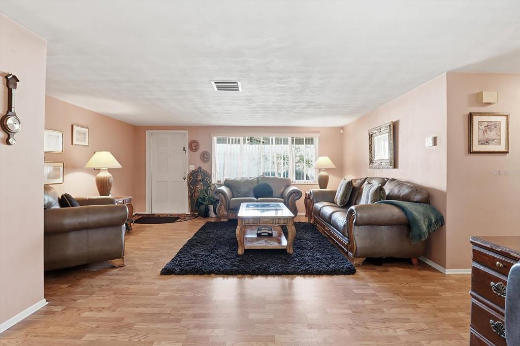 7410 Gulf Highlands Drive Port Richey, FL 34668 - Photo 11 of 45 a living room with furniture and a window