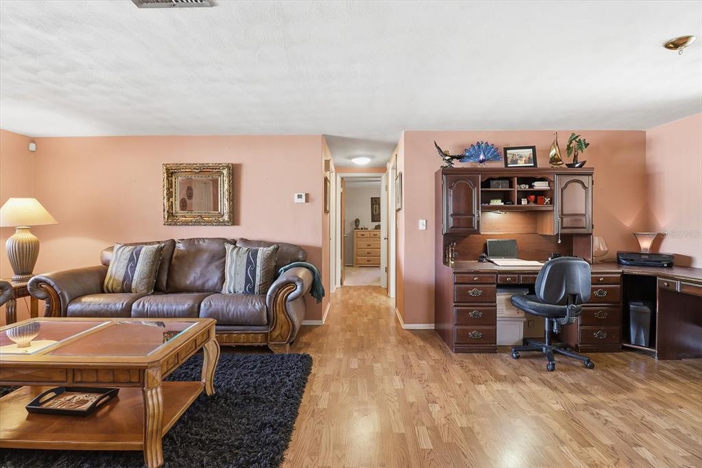 7410 Gulf Highlands Drive Port Richey, FL 34668 - Photo 12 of 45 a living room with furniture and a piano