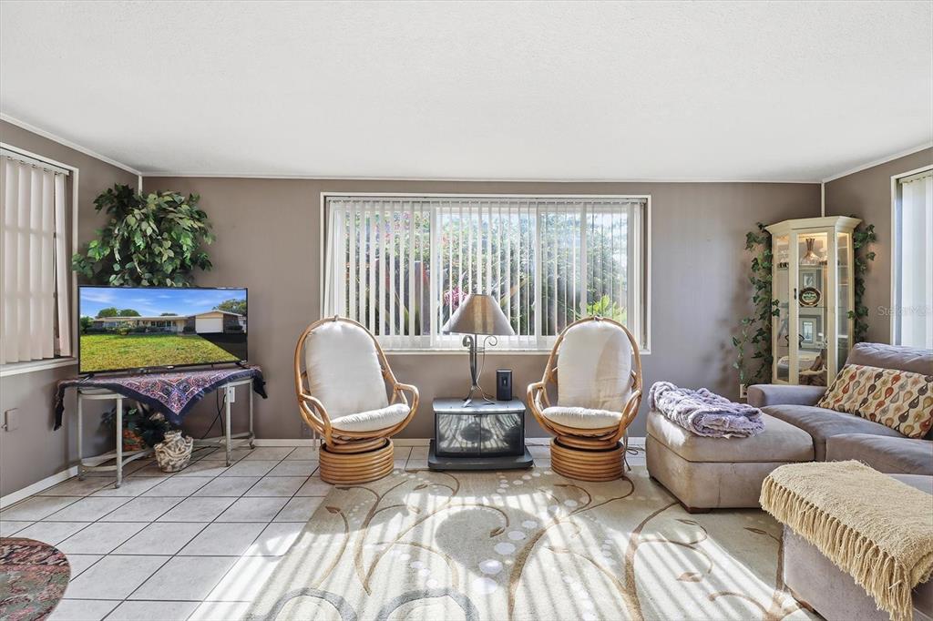 7410 Gulf Highlands Drive Port Richey, FL 34668 - Photo 20 of 45 a living room with furniture and a lamp