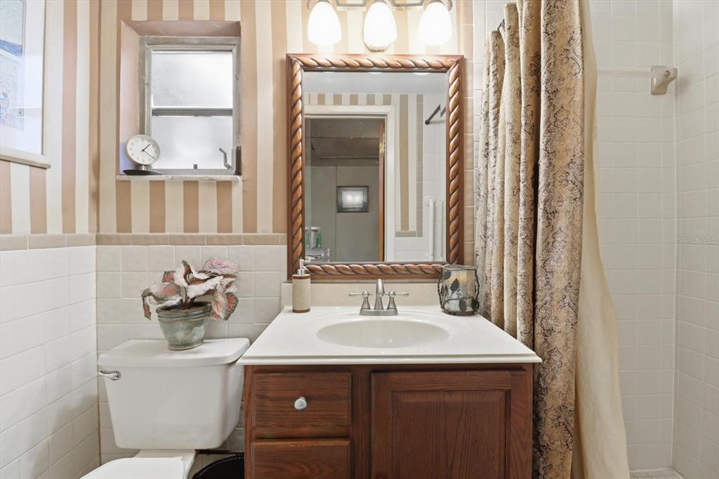 7410 Gulf Highlands Drive Port Richey, FL 34668 - Photo 32 of 45 a bathroom with a sink and a mirror