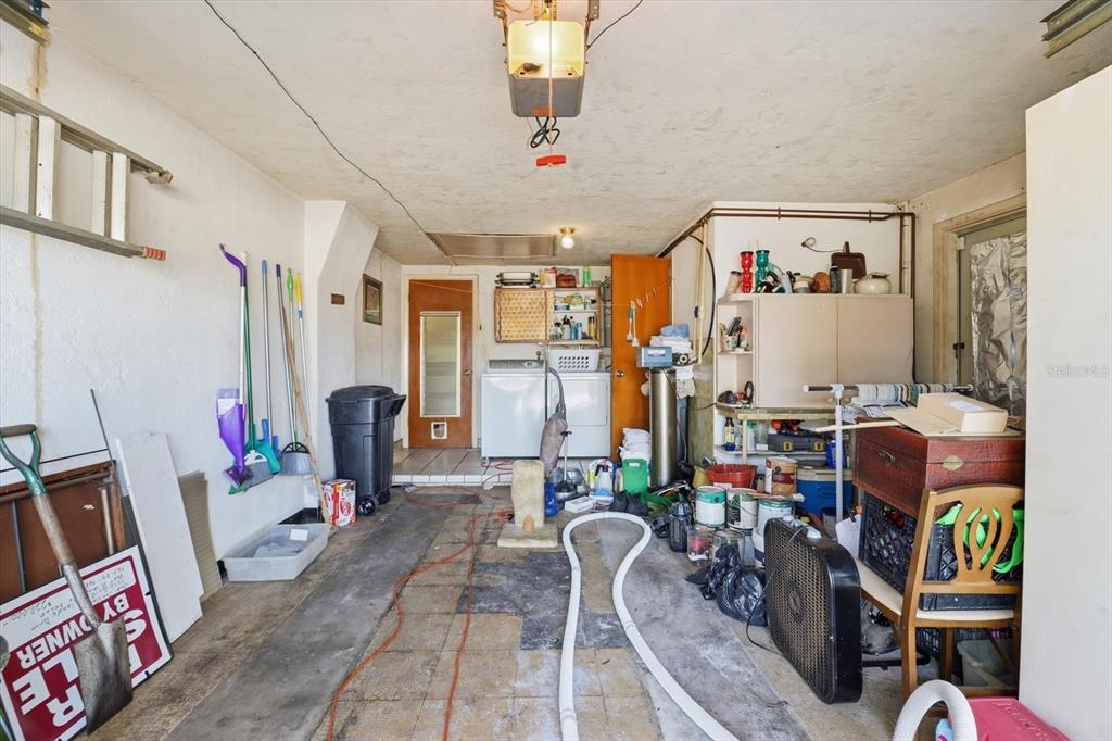 7410 Gulf Highlands Drive Port Richey, FL 34668 - Photo 35 of 45 a living room with lots of furniture and gym equipment