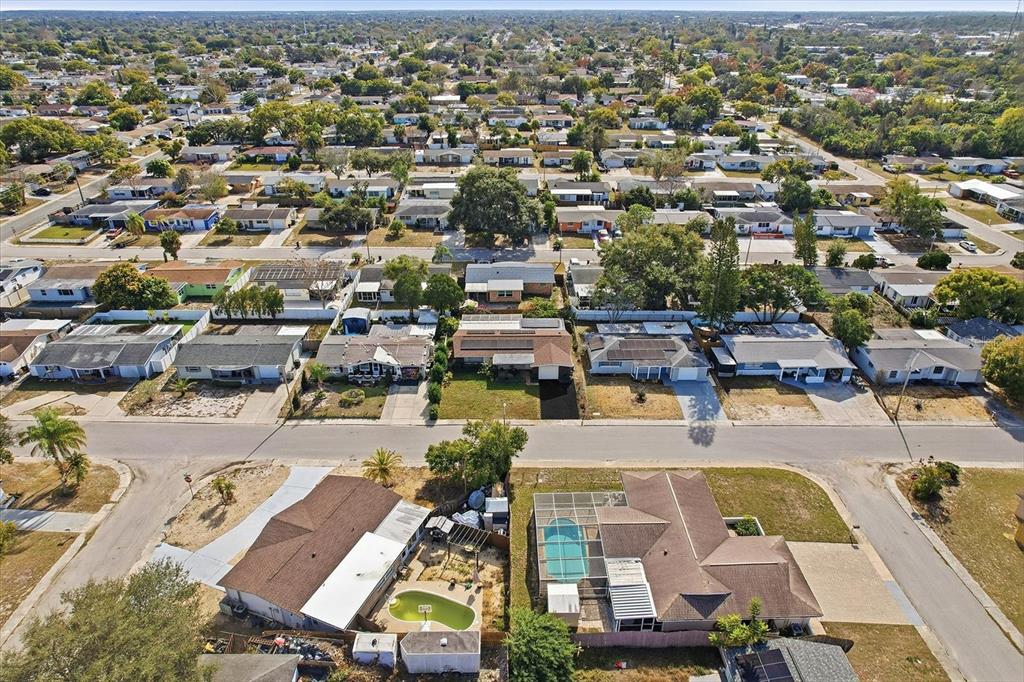 7410 Gulf Highlands Drive Port Richey, FL 34668 - Photo 40 of 45 an aerial view of a swimming pool with outdoor space