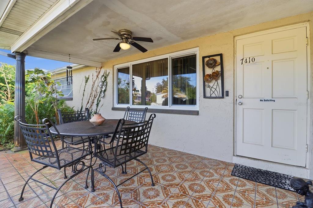 7410 Gulf Highlands Drive Port Richey, FL 34668 - Photo 5 of 45 a view of an outdoor dining space with a table and chairs