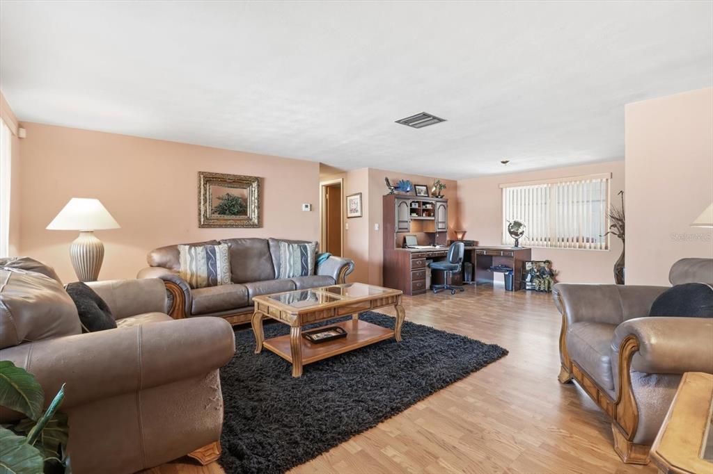 7410 Gulf Highlands Drive Port Richey, FL 34668 - Photo 7 of 45 a living room with furniture rug and window