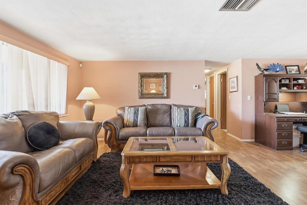 7410 Gulf Highlands Drive Port Richey, FL 34668 - Photo 8 of 45 a living room with furniture and a couch