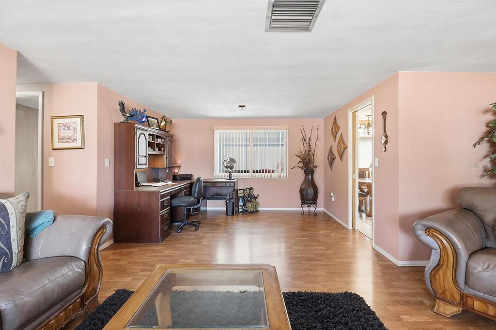 7410 Gulf Highlands Drive Port Richey, FL 34668 - Photo 9 of 45 a living room with furniture rug and window