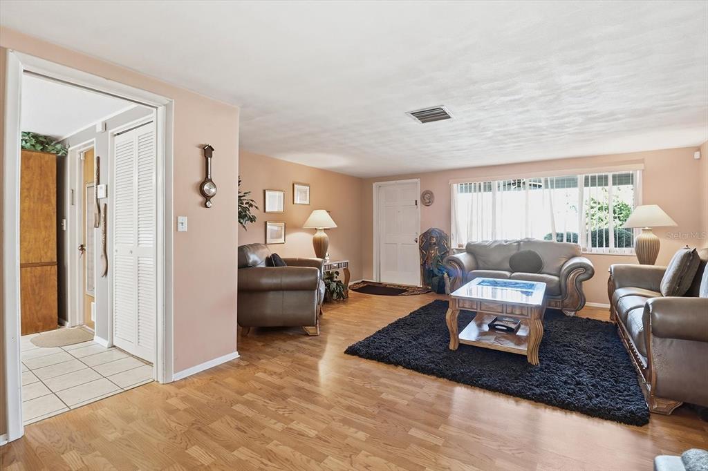 7410 Gulf Highlands Drive Port Richey, FL 34668 - Photo 10 of 45 a living room with furniture and a rug