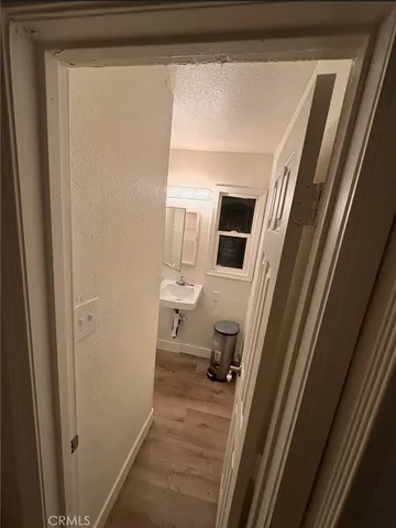 a kitchen with granite countertop a stove a microwave and a counter top space