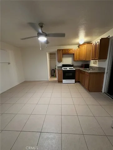 a view of an empty room and a hallway