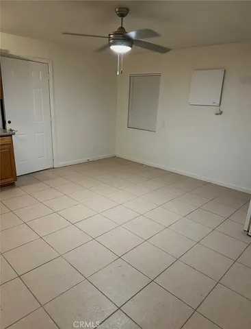 a kitchen with a stove and a refrigerator