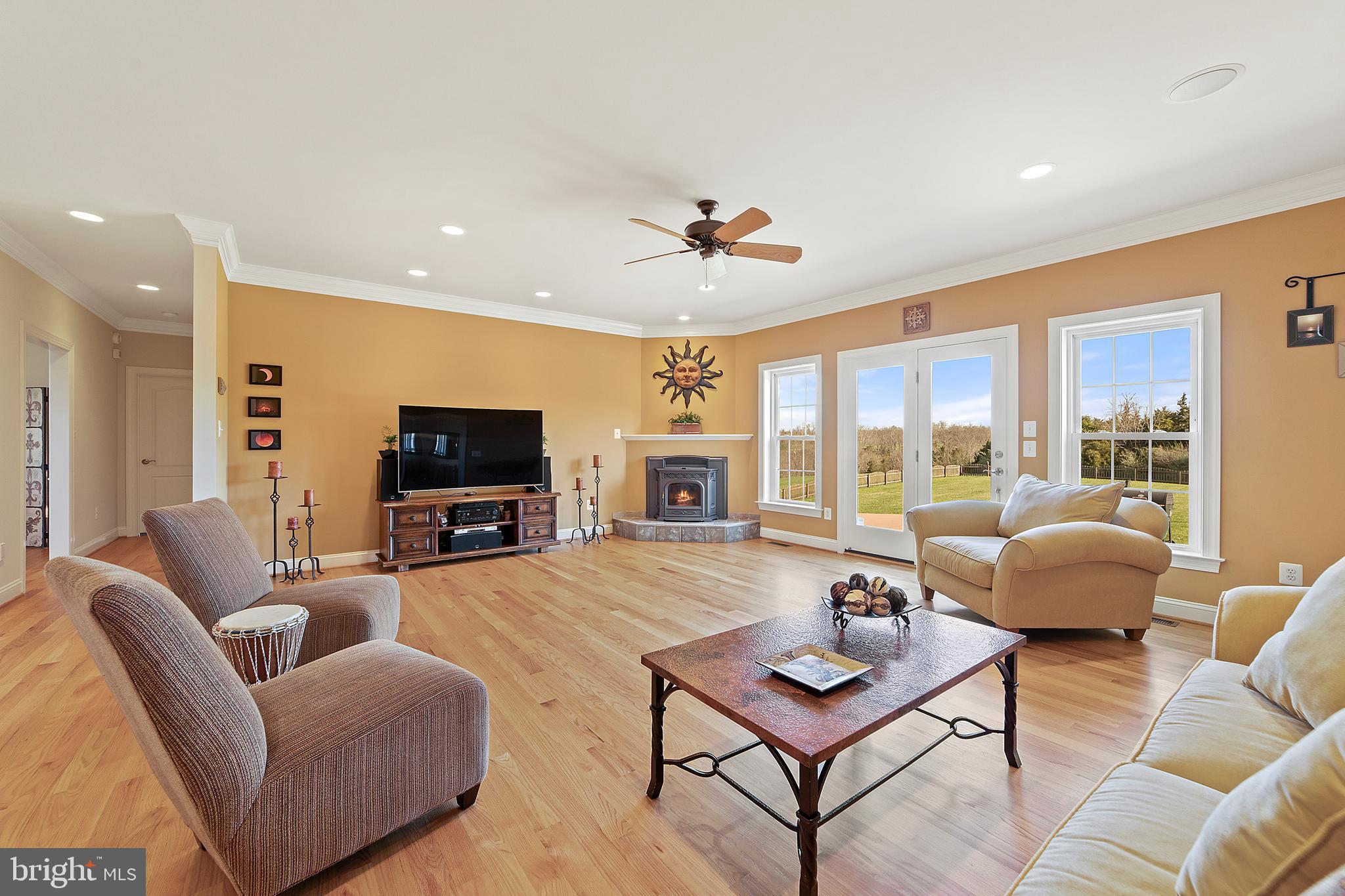 8633 Shepherds Way Rixeyville, VA 22737 - Photo 11 of 48 a living room with furniture a flat screen tv and a table