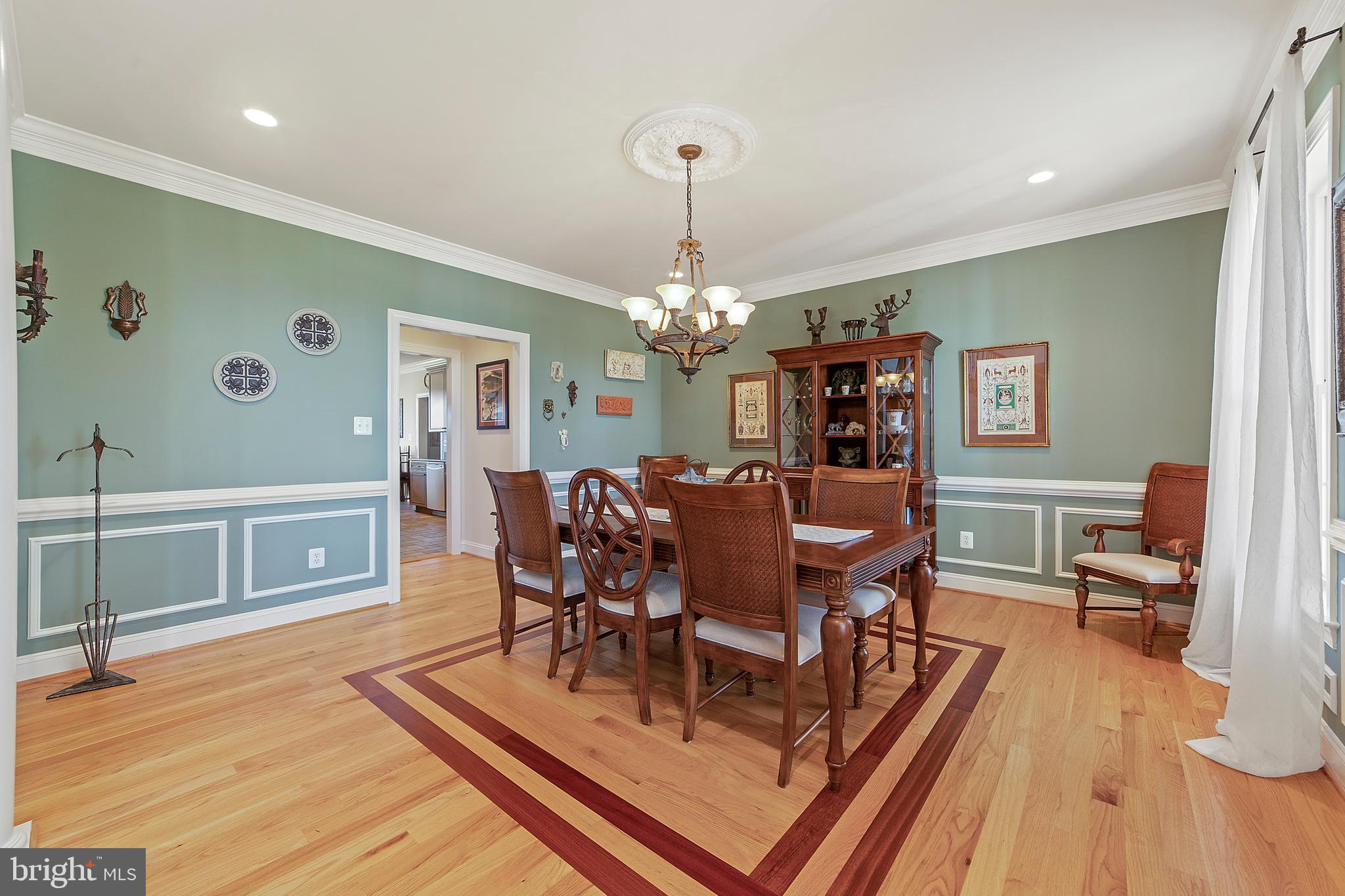 8633 Shepherds Way Rixeyville, VA 22737 - Photo 15 of 48 a view of a dining room with furniture window and wooden floor