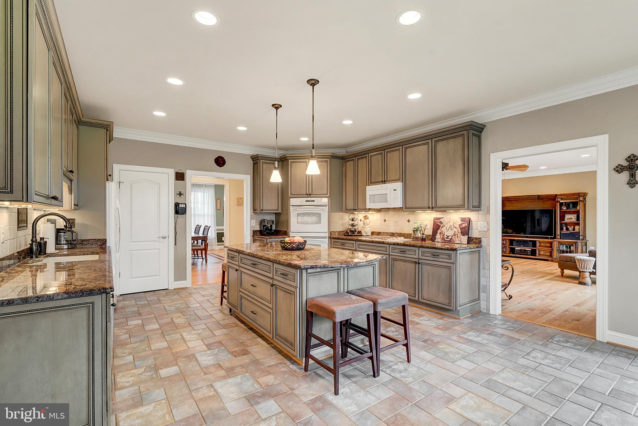 8633 Shepherds Way Rixeyville, VA 22737 - Photo 18 of 48 a large kitchen with granite countertop a large counter top appliances and cabinets