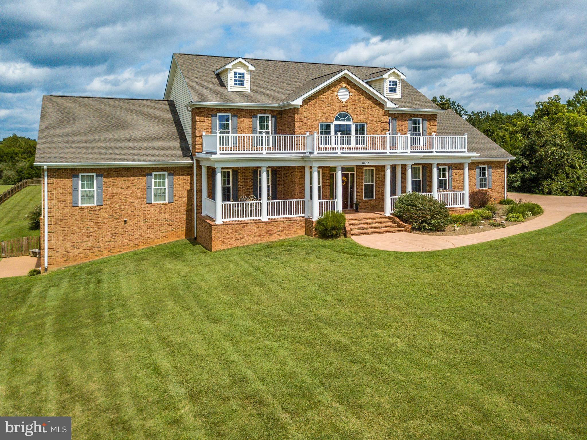 8633 Shepherds Way Rixeyville, VA 22737 - Photo 4 of 48 a front view of a house with a garden and trees