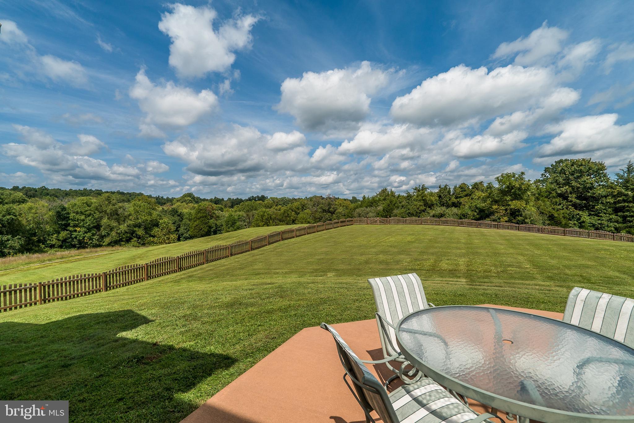 8633 Shepherds Way Rixeyville, VA 22737 - Photo 40 of 48 a view of a lake with couches chairs and city view