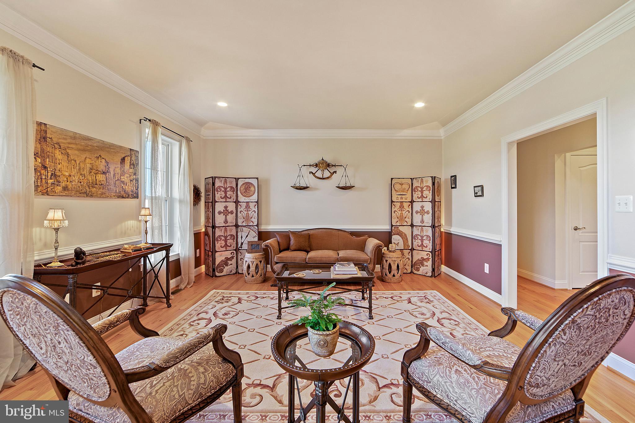 8633 Shepherds Way Rixeyville, VA 22737 - Photo 9 of 48 a living room with furniture a rug and a table