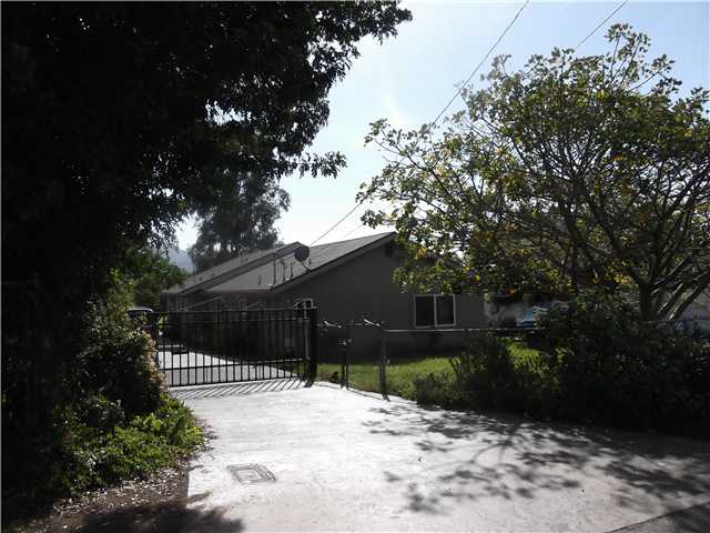 14033 Proctor Valley Road Jamul, CA 91935 - Photo 1 of 18 Security gate accross driveway