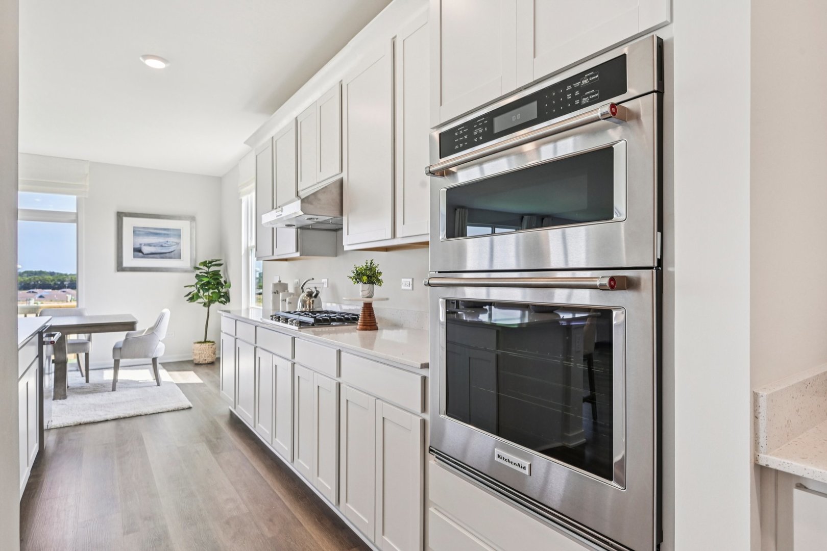 282 Snowdrop Lane Elgin, IL 60124 - Photo 12 of 54 a kitchen with white cabinets and appliances