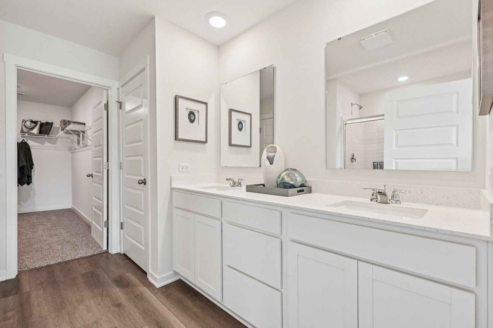 282 Snowdrop Lane Elgin, IL 60124 - Photo 30 of 54 a bathroom with double vanity sinks a mirror and a shower