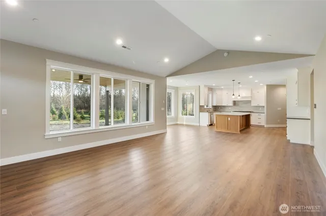 a view of kitchen with wooden floor and windows