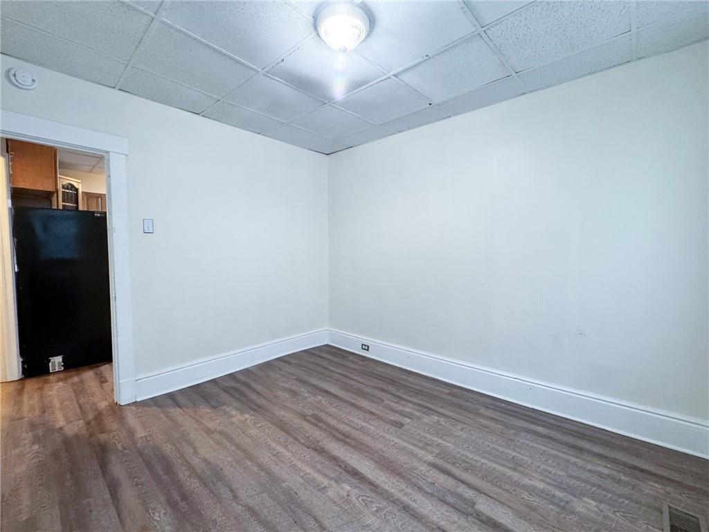 344 South Chestnut Street, Unit 2 Butler, PA 16001 - Photo 12 of 16 an empty room with wooden floor and windows