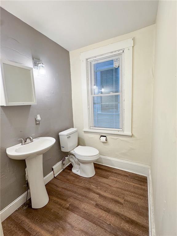 344 South Chestnut Street, Unit 2 Butler, PA 16001 - Photo 16 of 16 a bathroom with a toilet sink and mirror