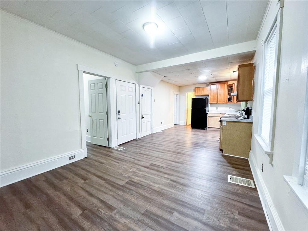 344 South Chestnut Street, Unit 2 Butler, PA 16001 - Photo 3 of 16 wooden floor in an empty room with a kitchen